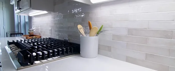 Modern kitchen showing countertop and backsplash meeting at the wall
